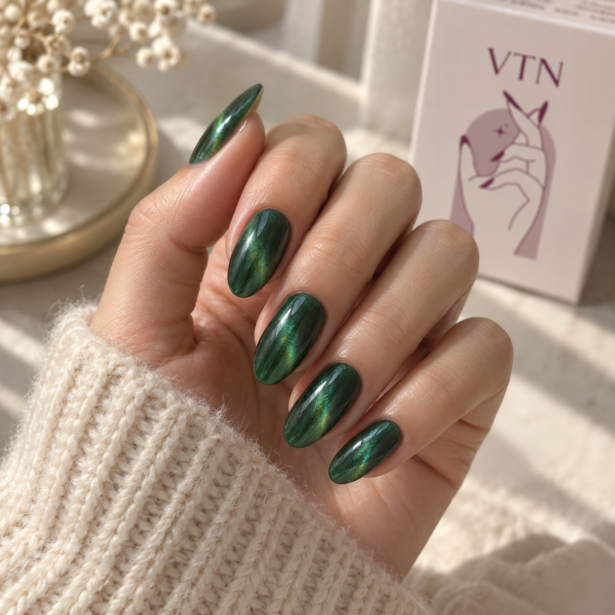 Emerald Flash press-on nails on a natural hand