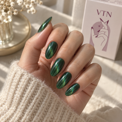 Emerald Flash press-on nails on a natural hand