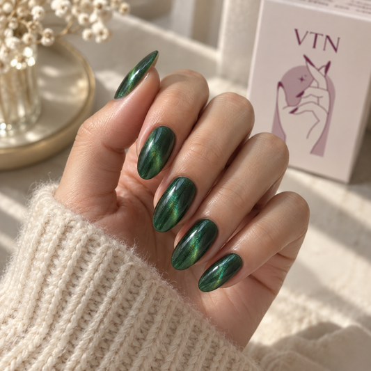 Emerald Flash press-on nails on a natural hand