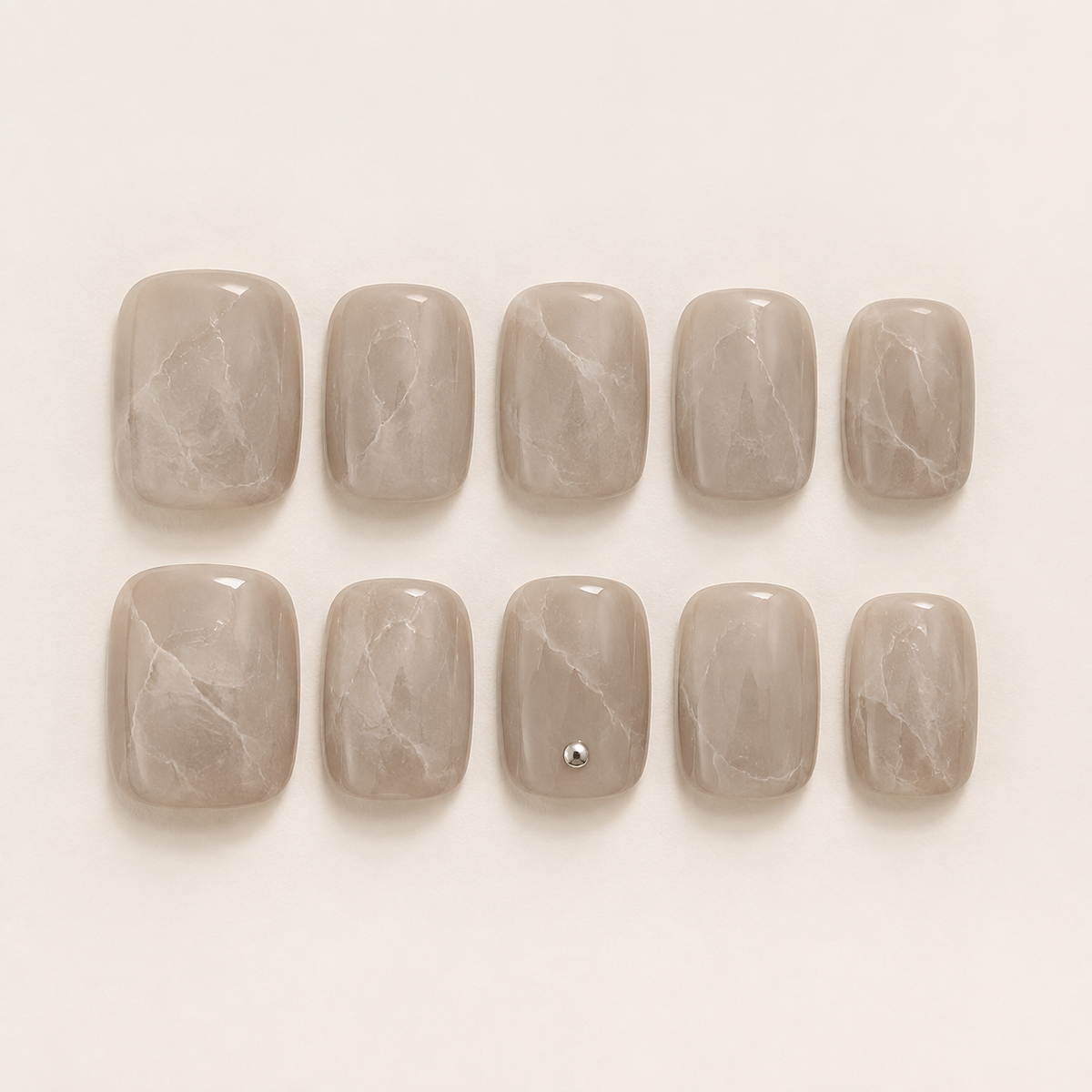 Press-on nail sizes arranged from large to small